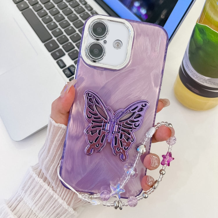 Plating Glitter Lens Film Texture Butterfly Holder Wristband Phone Case, For iPhone 16 Plus